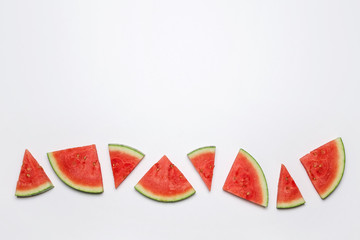 Slices of watermelon on a white background. Top view. Copy space.