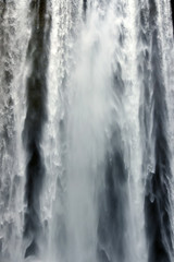 Fototapeta na wymiar Tourist at Skogafoss Waterfall, famous natural landmark in Iceland, Europe