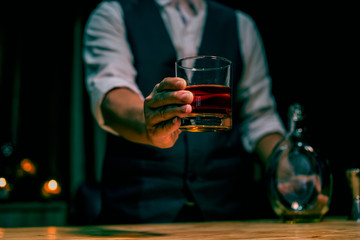 man with glass of whiskey