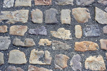 Paving stones road with gravel