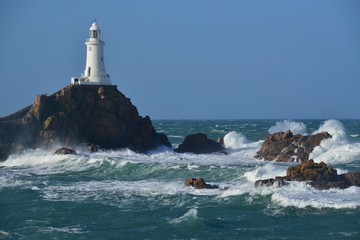 La Corbiere point, Jersey, U.K. Lighthouse with stormy conditions from the Atlantic.