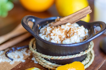Homemade rice pudding dessert with lemon, orange and cinnamon flavor