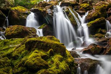 Mossy rocks in waterfall
