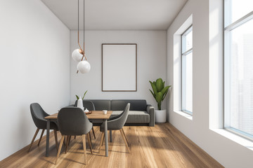 White dining room interior with, sofa and poster