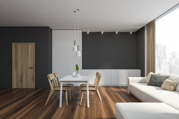 Gray dining room interior with sofa