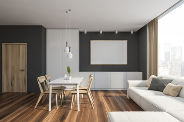 Gray dining room interior with sofa and poster