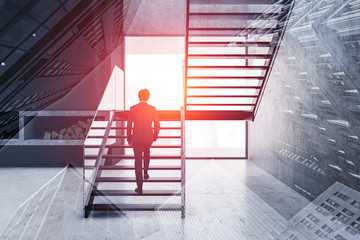 Businessman on stairs in luxury living room
