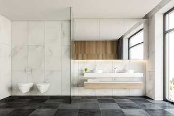 Naklejka na ściany i meble White marble bathroom with double sink and toilet