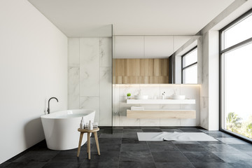 Fototapeta na wymiar White marble bathroom interior with sink and tub