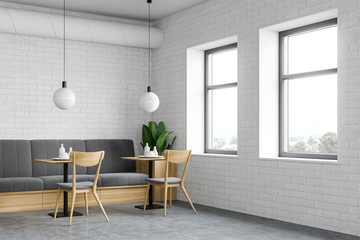 White brick loft restaurant corner with sofa