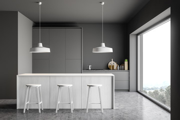 Gray kitchen with white bar and stools