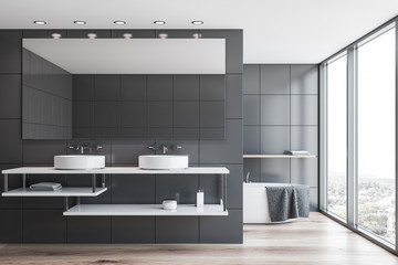 Gray tile bathroom interior with tub and sink