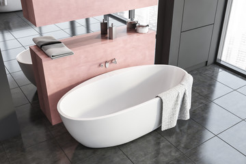 Top view of tub in gray and pink bathroom