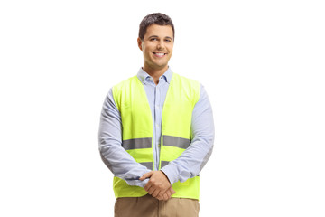 full length portrait of young man with arms crossed and safety vest