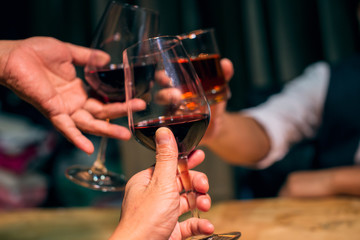 young woman holding a glass of red wine