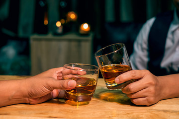 man with glass of whiskey