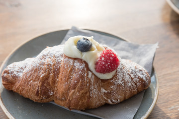 Croissants with berries and cream