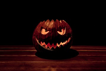 One spooky carved halloween pumpkin lonely dark twilight night. Big helloween autumn symbol with...