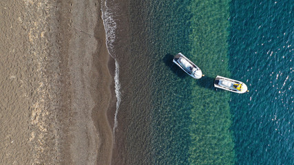 Aerial drone photo of small jet ski water craft docked in Mediterranean bay