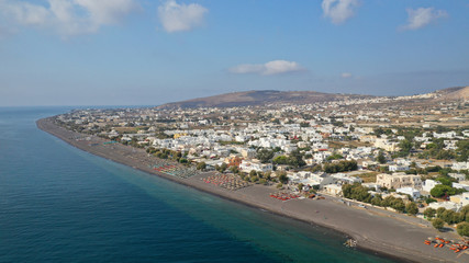 Fototapeta na wymiar Aerial drone photo of famous volcanic beach and bay of Perissa village, Santorini island, Cyclades, Greece