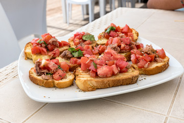 Appetizer of bruschetta with tuna