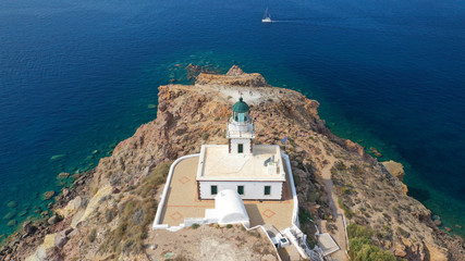 Aerial drone photo of iconic lighthouse of Akrotiri near Akrotiri village, Santorini island, Cyclades, Greece