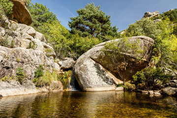 Small water lagoon called Kinderland Pond in the mountains of Madrid, right in La Pedriza