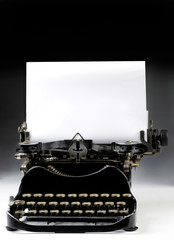 Antique Typewritter with blank paper for your type or text. .