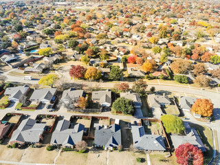 Aerial view row of new house with cul-de-sac (dead-end) and bright orange color fall foliage near Dallas