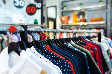 Fashionable dresses in polka dots on clothing garmet rack