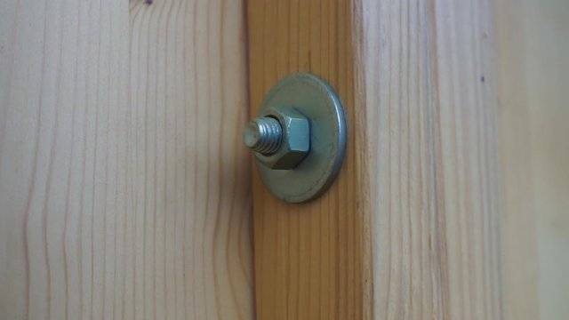 fastening a wooden strip with screw nut and washer