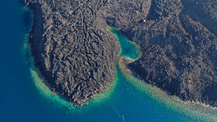 Aerial drone top down photo of iconic main Crater of Santorini volcanic island called Kameni...