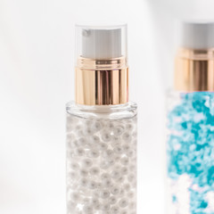 Skincare serum and make-up primer gel bottle, moisturizing lotion and lifting cream emulsion,...