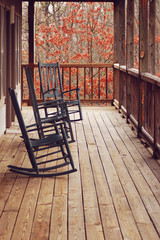 Fototapeta na wymiar rocking chairs on front porch in fall