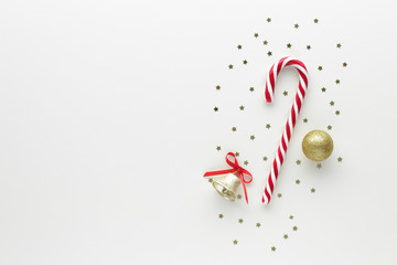 Christmas composition. Candy cane gift bauble star top view background with copy space for your text. Flat lay.