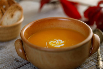Pumpkin cream soup in a ceramic dish