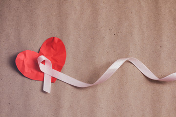 Pink ribbon. Symbol of breast cancer awareness. Health care conception. Preventive measures. October checking time.	