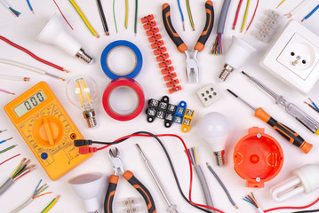 Electrician equipment on white background with copy space. top view	