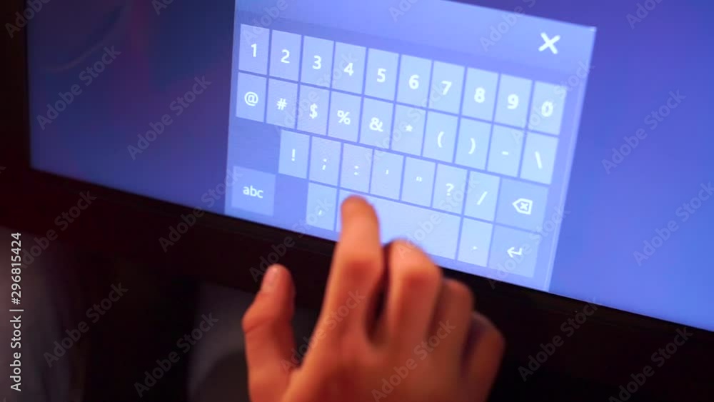 Poster child uses a numeric keypad on a computer monitor