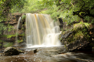 waterfall in forest keld yorkshire dales