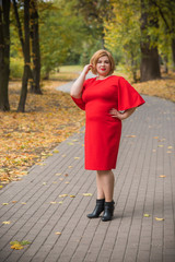 Mature fashionable plus size woman, concept of middle age lady lifestyle, plump people 