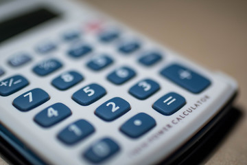 calculator with blue keys on white background
