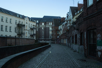 panoramic view of the evening city street with low old houses, Dusseldorf, Germany, December 10, 2018