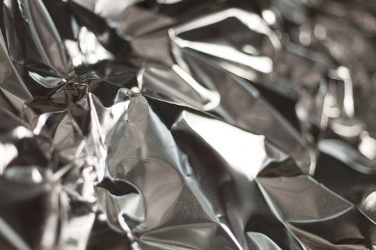 Full frame take of a sheeT of crumpled silver aluminum foil