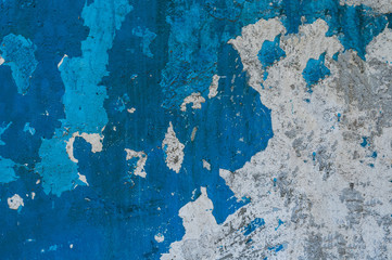 concrete wall texture, white-blue wall. peeling paint