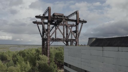 Rusty giant crane loading reactors of the 5th and 6th Chernobyl power units in the Chernobyl exclusion zone, Ukraine.