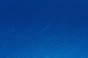 Small dents on blue paint texture