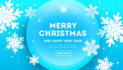 Creative Christmas banner with volumetric snowflakes and glitter decor on a blue background.