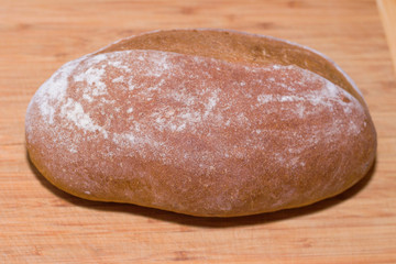 home baked bread on wooden background