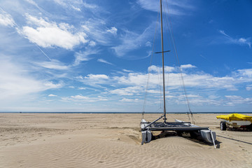 Resting catamaran on IJmuiden Beach (NL)